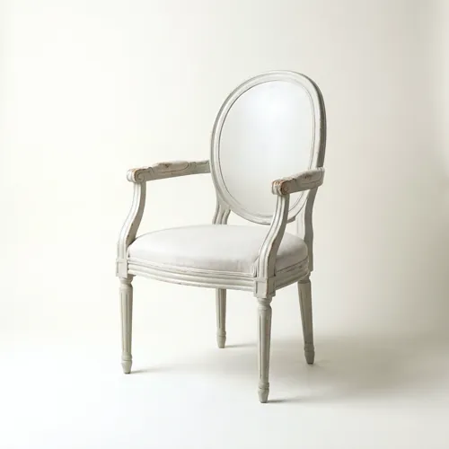 A painted Gustavian armchair with an oval medallion back and fluted legs